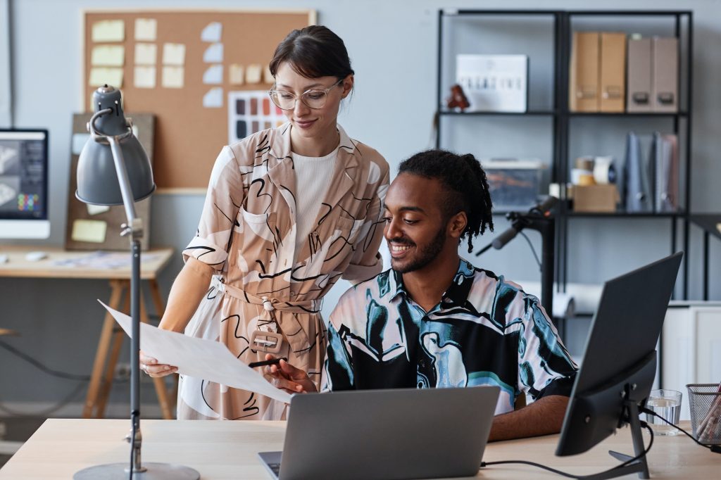 Man and woman collaborating on creative design